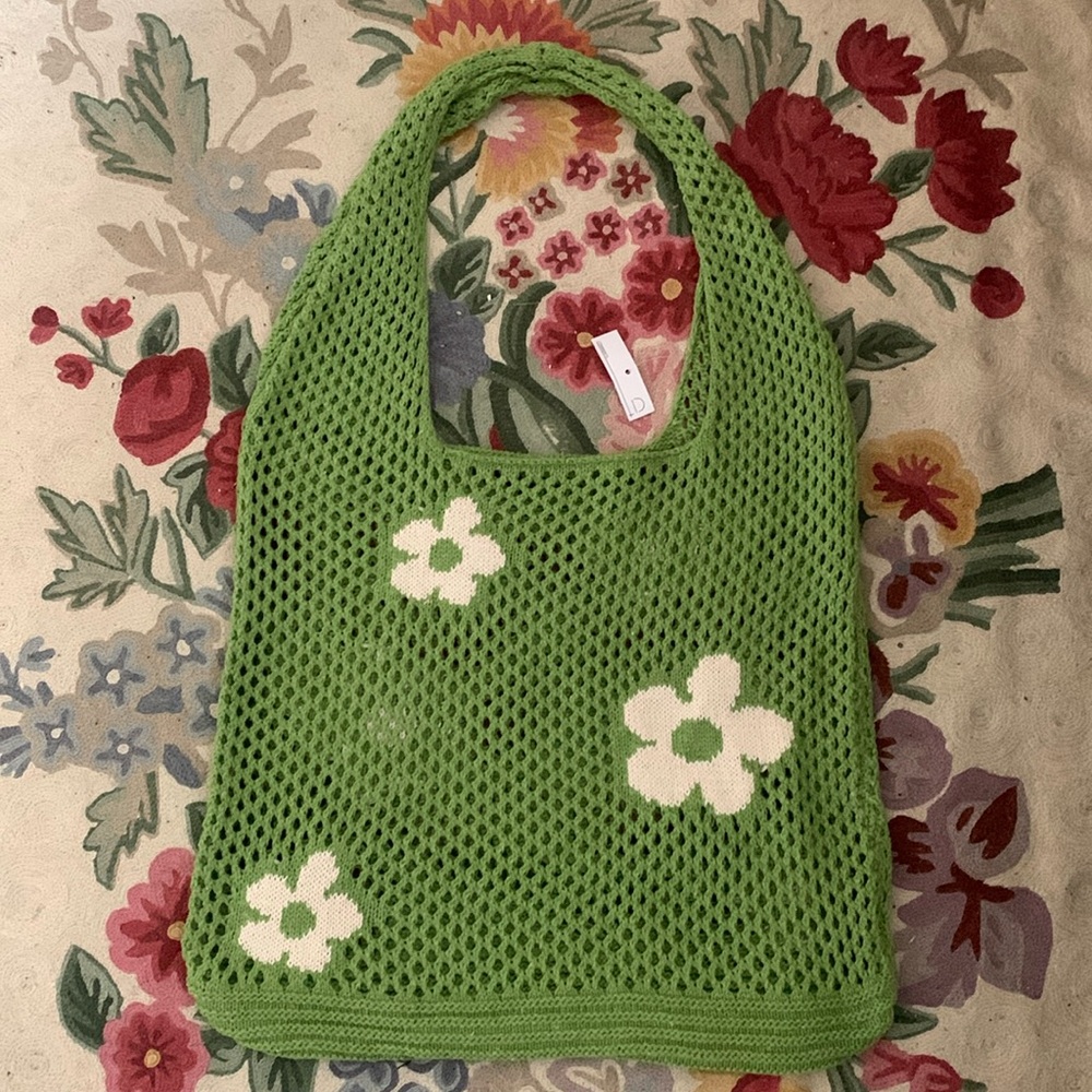 New, never used hand knit summer tote bag with inset daisy motifs.